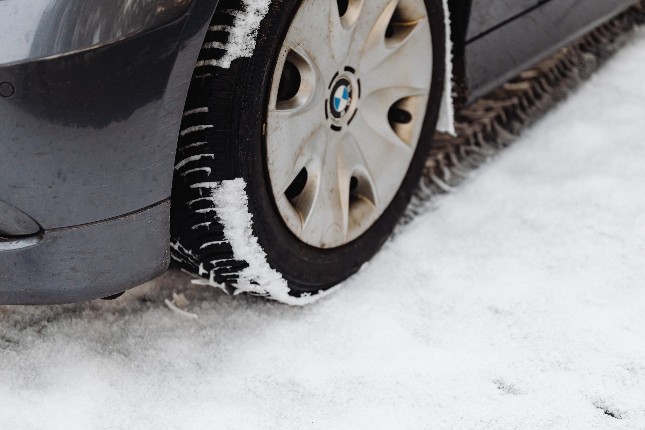 Car tire leaving a footprint in the snow